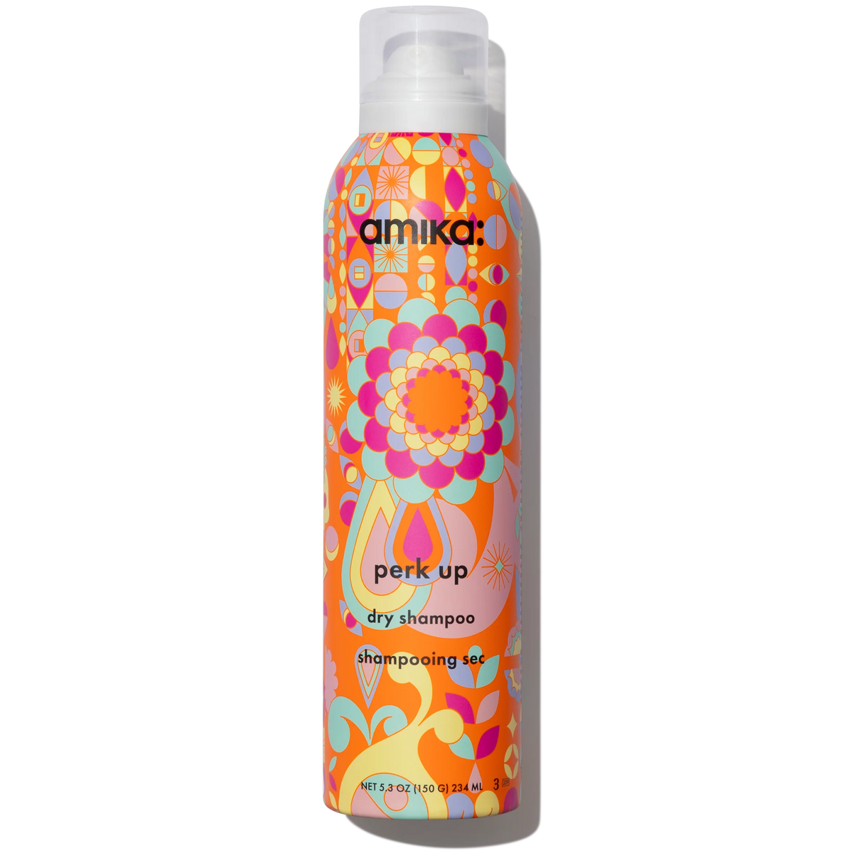 A bottle of amika Perk Up Dry Shampoo with a colorful patterned label.