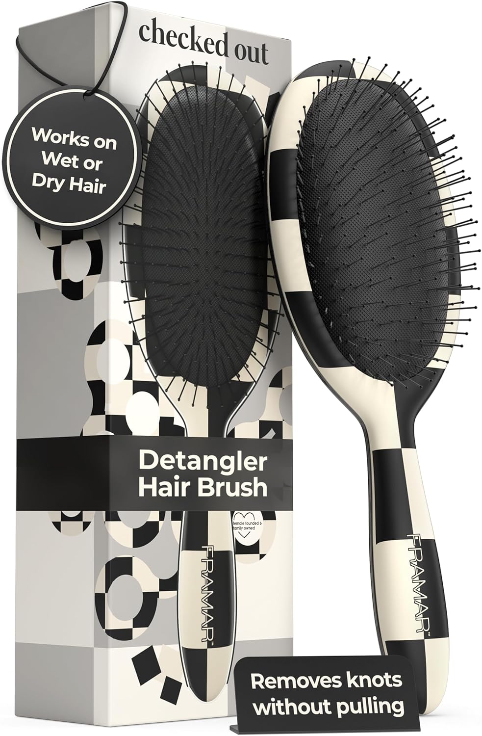 Detangler hair brush with packaging displaying text about its use on wet or dry hair.