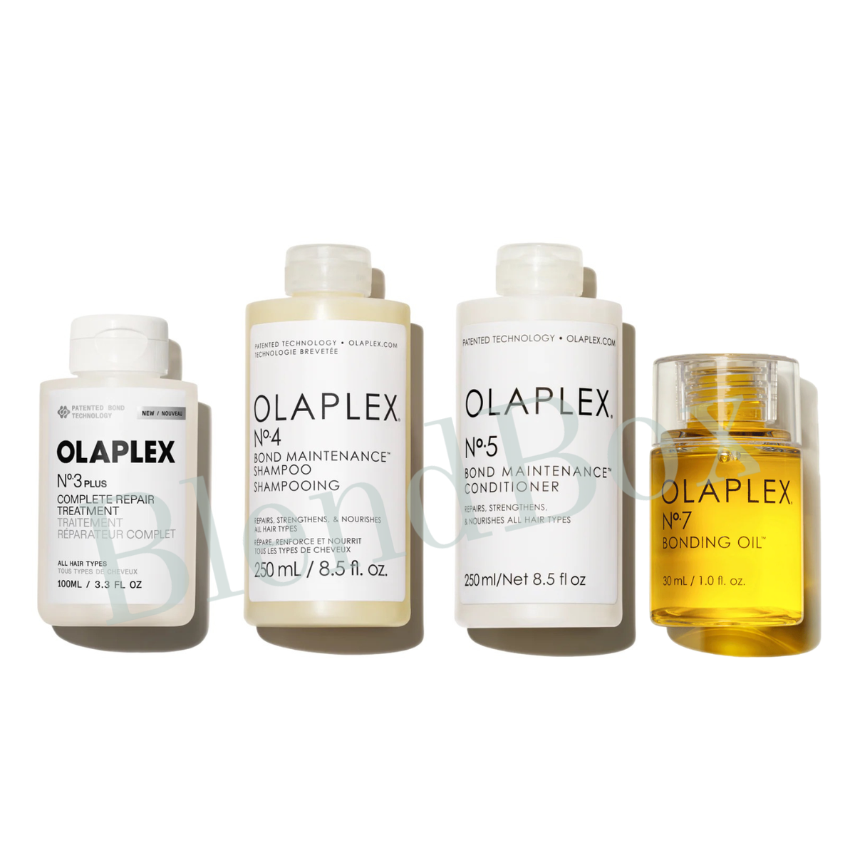 Set of Olaplex hair care products including shampoo, conditioner, and oil on a white background