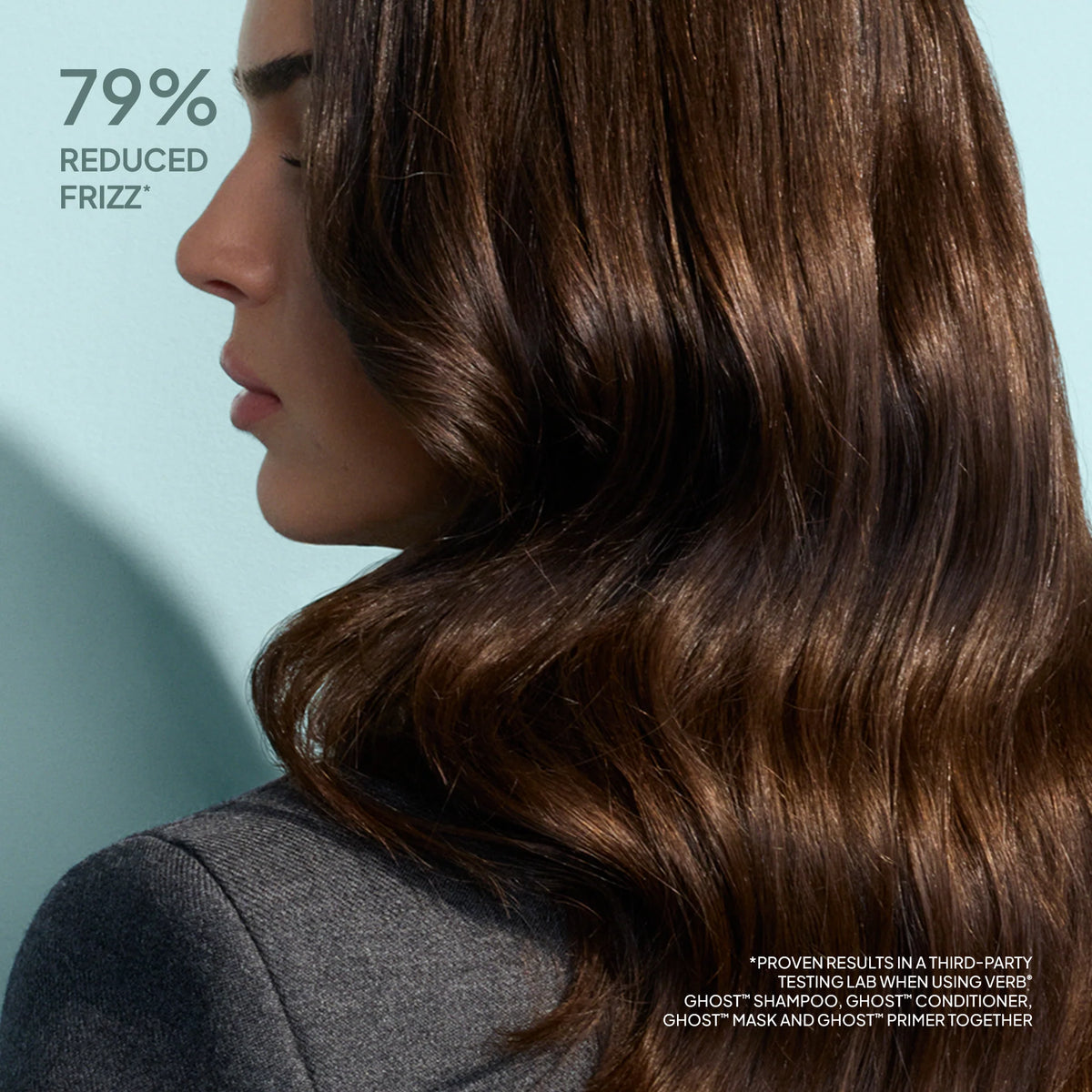Woman with smooth, straight hair against a light blue background