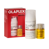 Olaplex Iconic Stylers Set featuring a red retail box, a white styling treatment bottle, and a clear bottle of golden bonding oil on a white background.