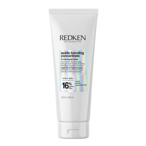Redken acidic bonding concentrate tube on a white background