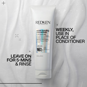 Redken hair care product with usage instructions on a gray background