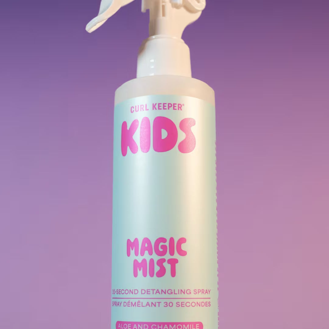 A bottle of Curl Keeper Kids Magic Mist 2-second detangling spray, featuring a white and light blue design with pink lettering, set against a purple gradient background.