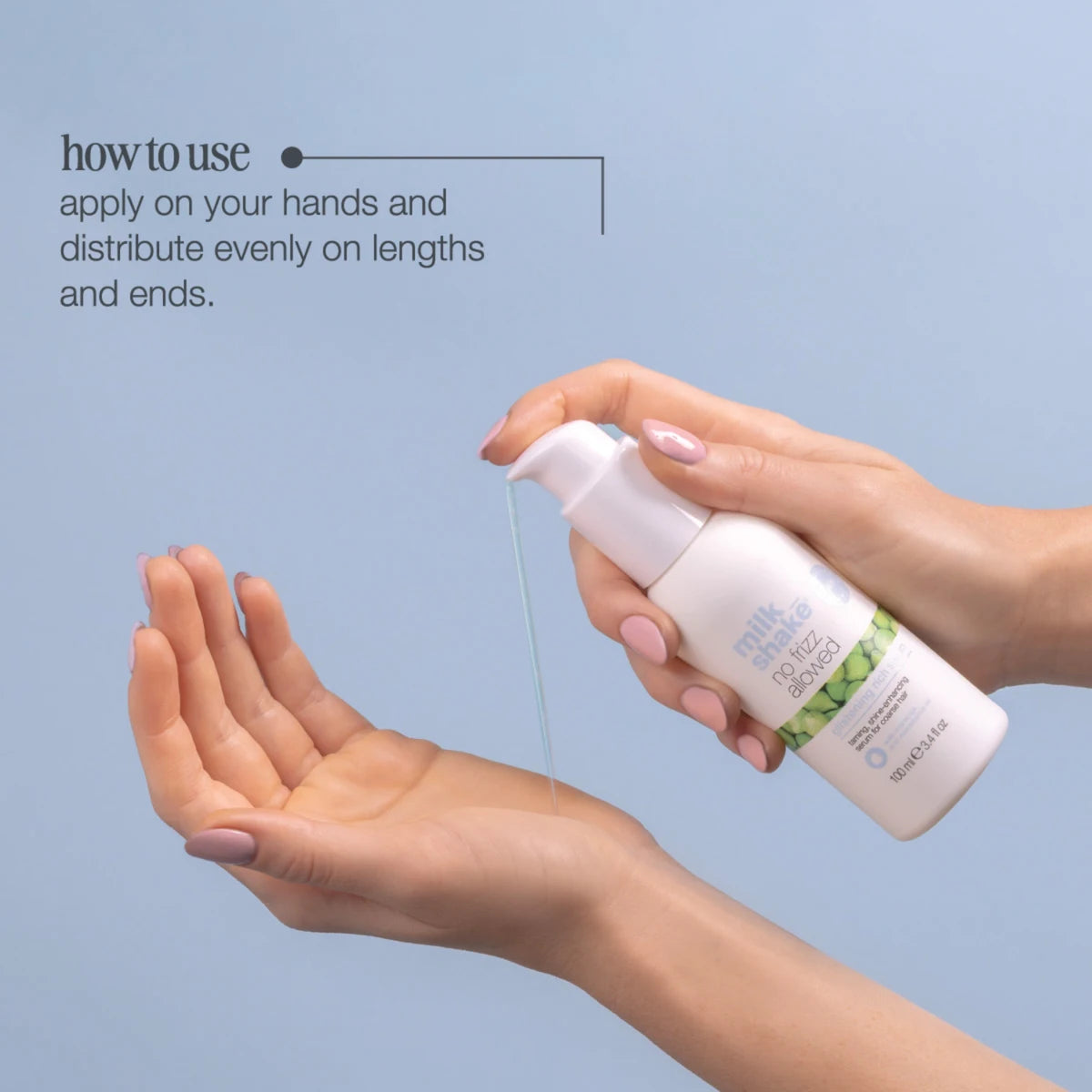 Hand holding a spray bottle with text on how to use it against a light blue background