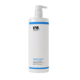 K18 Damage Shield shampoo bottle on a white background