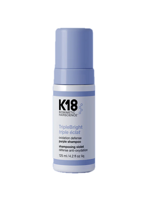 K18 purple shampoo bottle on a white background