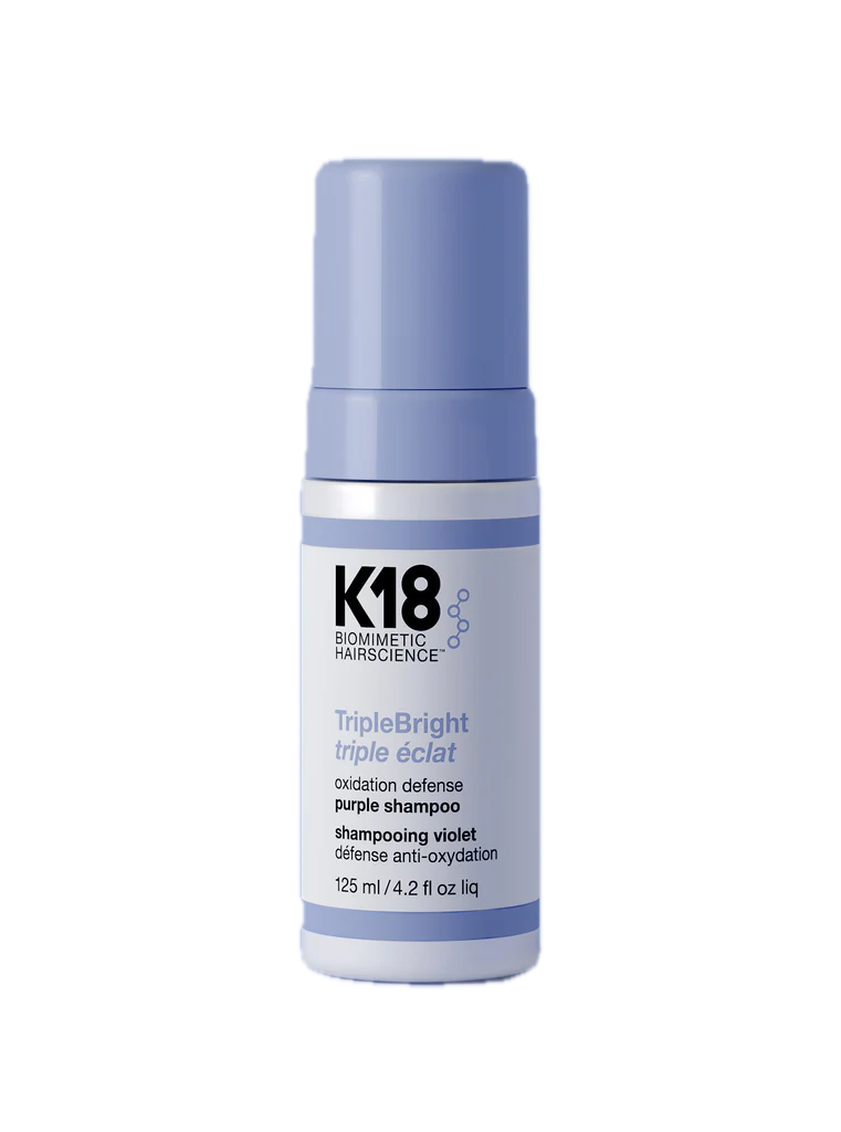 K18 purple shampoo bottle on a white background