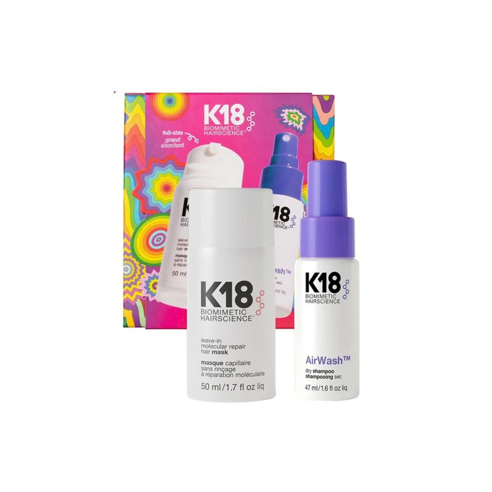 K18 Biometric Hair Science hair care set featuring a white foam bottle, a white spray bottle with a purple cap labeled AirWash, and a colorful spiral-patterned box in the background.