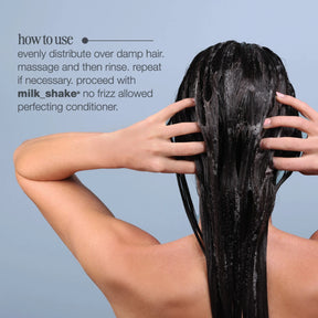 Person applying hair product with text on how to use it against a light blue background
