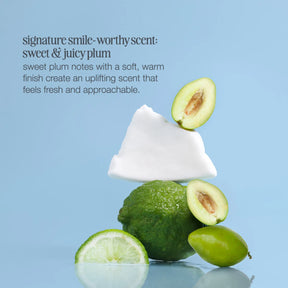 White cone with green fruit on a blue background, promoting a sweet and juicy plum scent.