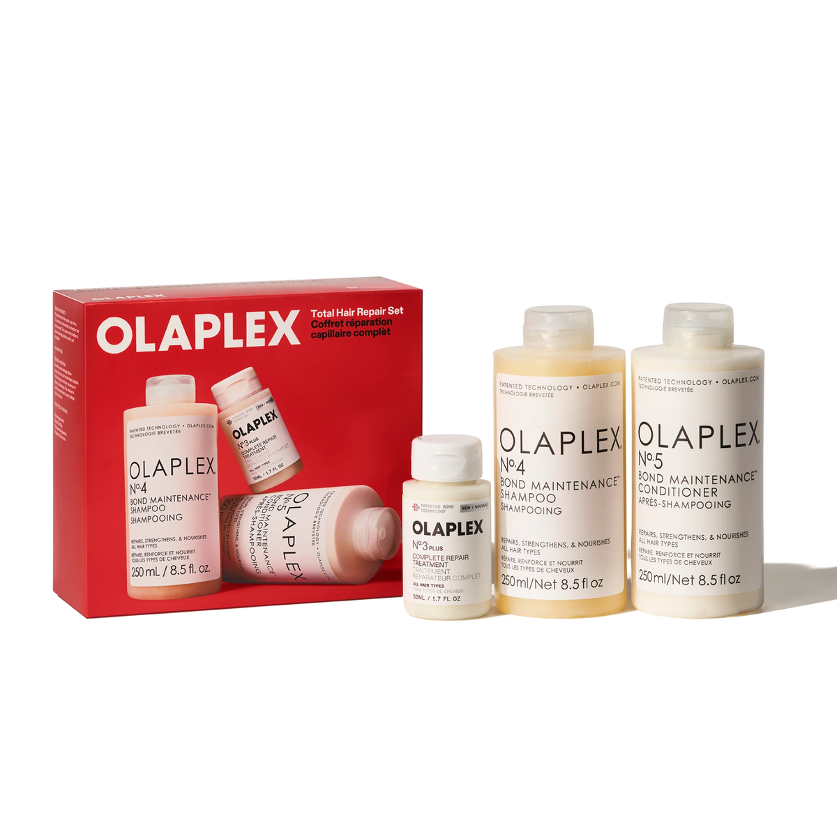 Olaplex Total Hair Repair Set including a red box and four bottles of hair care products on a white background.