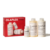 Olaplex Total Hair Repair Set including a red box and four bottles of hair care products on a white background.
