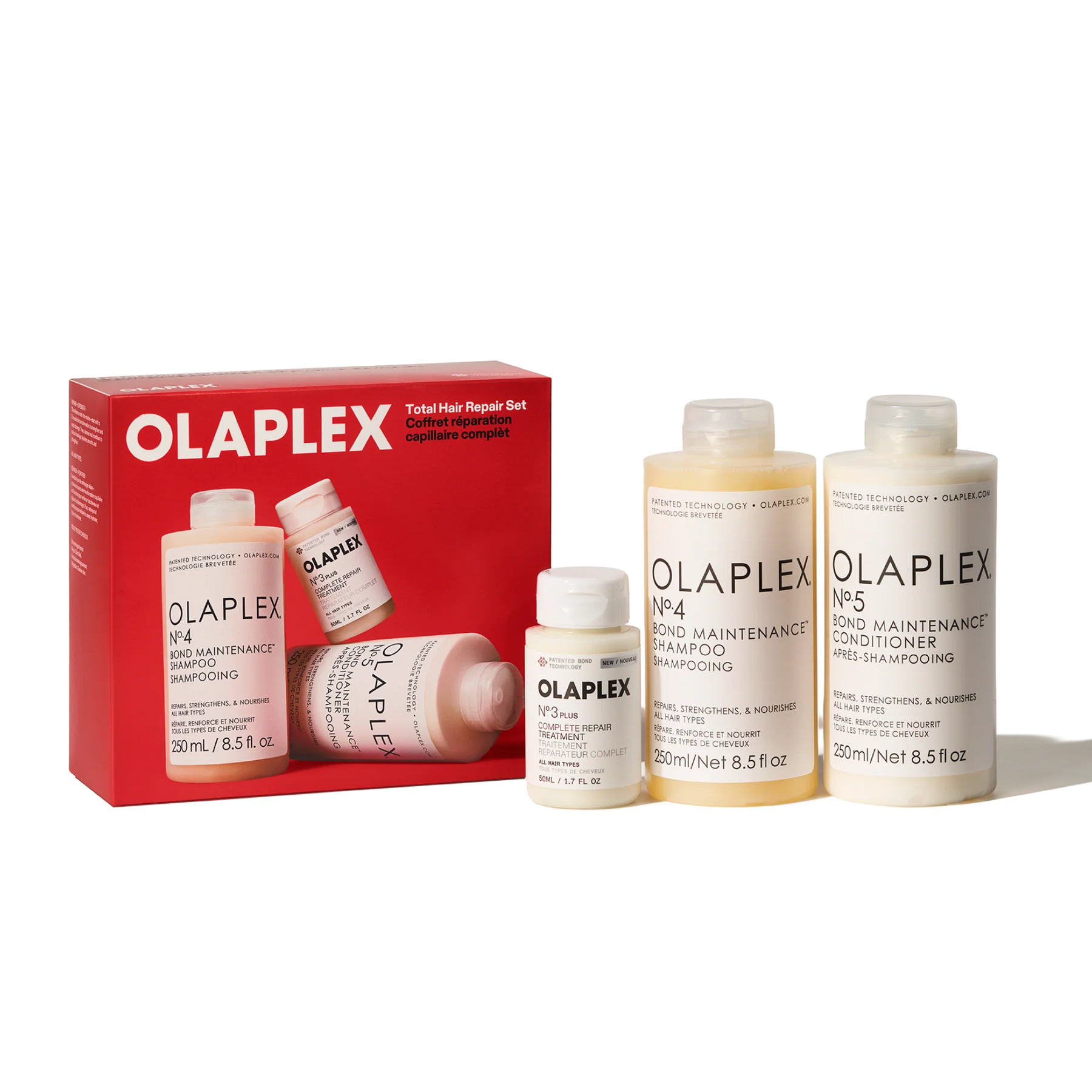 Olaplex Total Hair Repair Set including a red box and four bottles of hair care products on a white background.