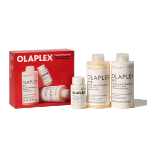 Olaplex Total Hair Repair Set including a red box and four bottles of hair care products on a white background.