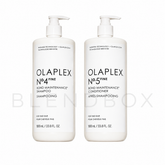 Two white pump bottles of Olaplex No.4 Fine Bond Maintenance Shampoo and No.