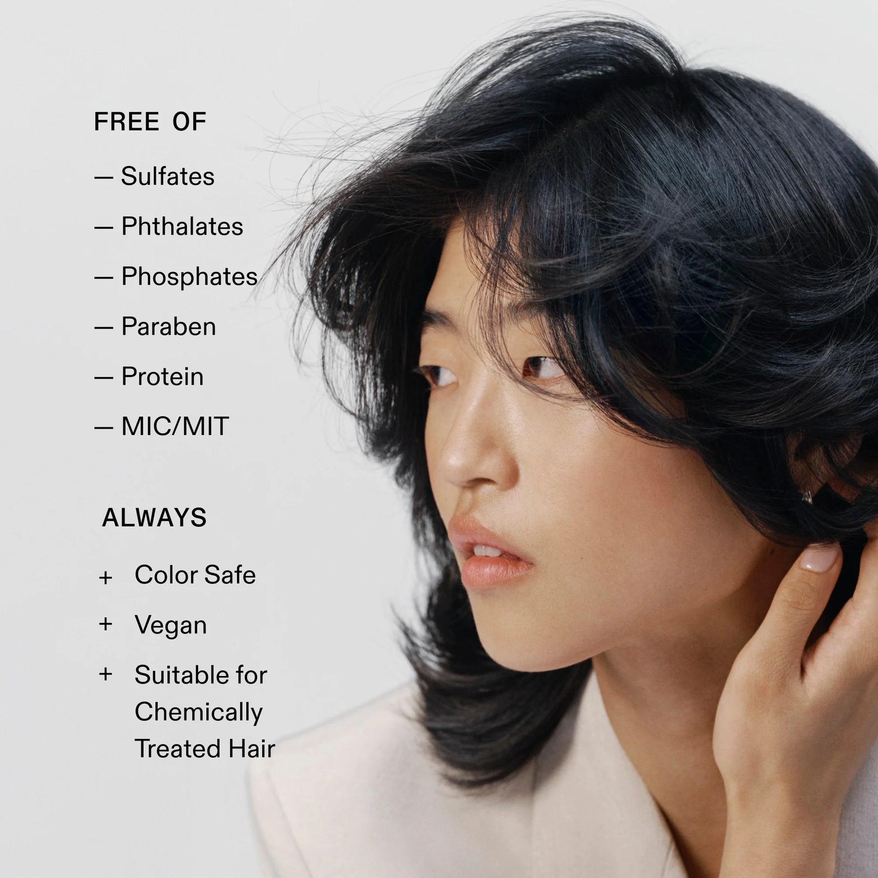 A woman with shoulder-length black hair shown in profile against a light gray background, with text on the left listing benefits such as free from sulfates, phthalates, phosphates, parabens, protein, and mic/mit, plus color safe, vegan, and suitable for chemically treated hair.
