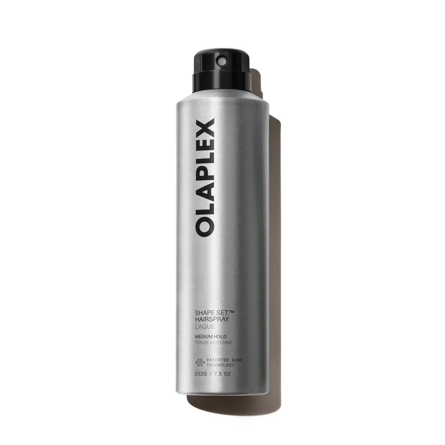 A silver aerosol can of Olaplex Shape Set Hair Spray with a black spray nozzle, shown on a clean white background with a soft shadow.