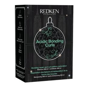 Redken Acidic Bonding Curls shampoo and conditioner box, 300 ml each, in black packaging with a large ornament graphic and teal text.