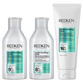 Redken hair care products including shampoo, conditioner, and treatment on a white background