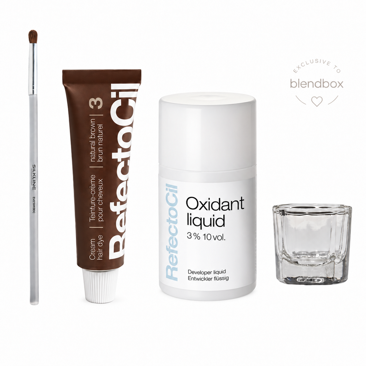 A hair dye kit from RefectoCil on a white background, including a brown cream hair dye tube, a clear applicator brush, a white oxidant liquid bottle, and a small clear glass mixing cup. A 'Exclusive to Blendbox' badge is visible in the upper right.