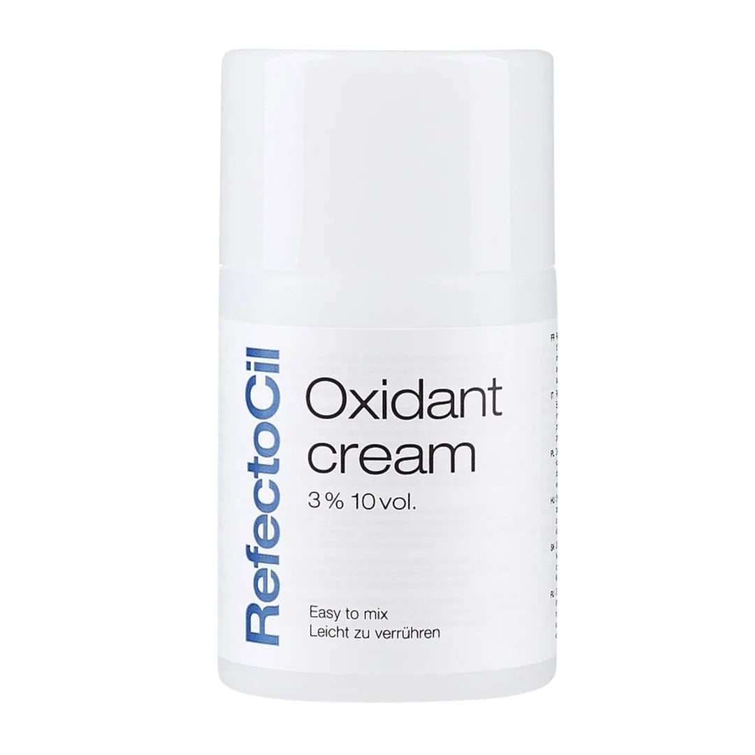 A white cylindrical bottle of RefectoCil Oxidant cream 3% 10 vol. on a solid white background.