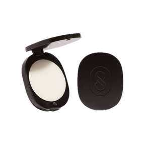 black compact case with white solid perfume