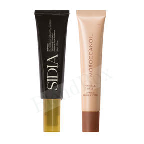 Two lip balm tubes, one black and one beige, on a white background