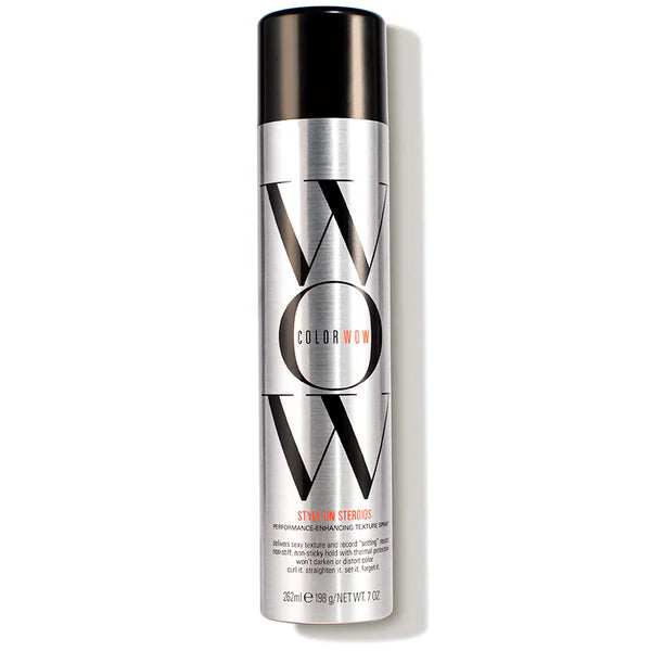 Silver and black bottle of Color Wow hair product on a white background
